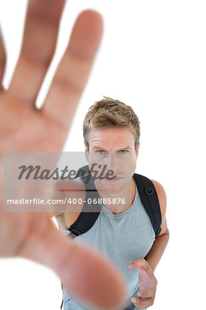 Attractive man catching the camera on white background