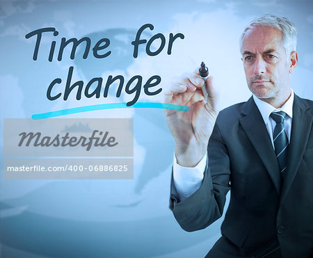 Businessman writing time for change with a marker