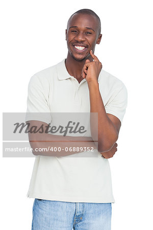 Happy man with hand on chin on a white background