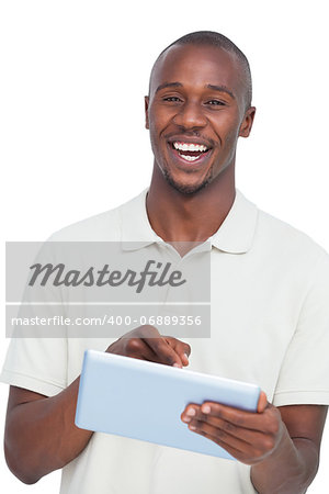 Portrait of a laughing man with tablet pc on a white background