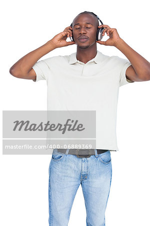 Man listening to music with headphones on a white background