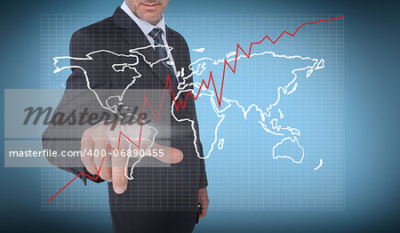Businessman selecting a world map on blue background