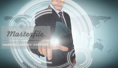 Businessman selecting a futuristic dial with world map on the background