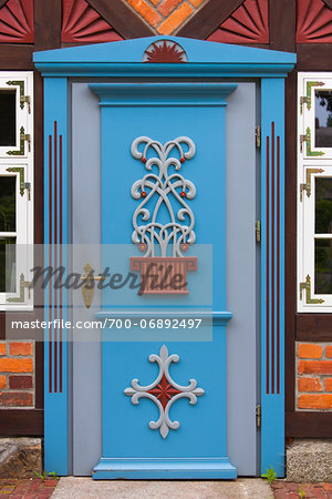 Frame house with ornate door, Born, Fischland-Darss-Zingst, Coast of the Baltic Sea, Mecklenburg-Western Pomerania, Germany, Europe