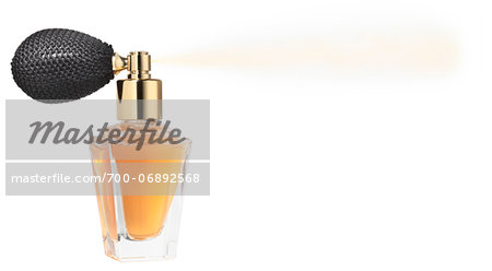 perfume spray bottle on white background with copyspace