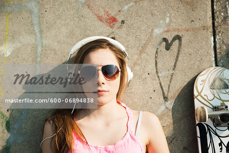 Teenager wearing Headphones in Skatepark, Feudenheim, Mannheim, Baden-Wurttemberg, Germany