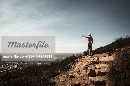 Man pointing at view over San Diego, California, USA
