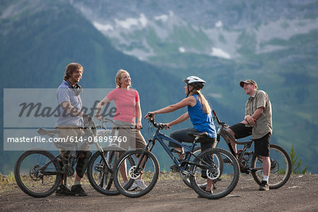 Four friends mountain biking together