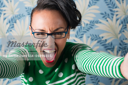 Retro style portrait of woman with arms open