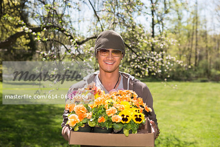 Man holding box of flowers