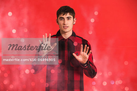 Portrait of young man wearing checked shirt