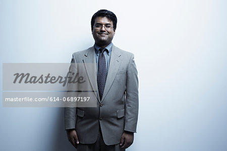 Studio portrait of mid adult male in suit