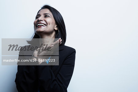 Studio portrait of businesswoman smiling
