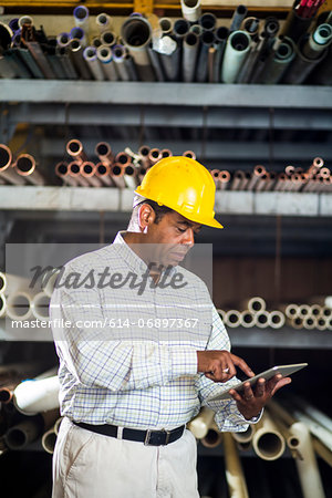 Man in warehouse with digital tablet Man in warehouse with digital tablet