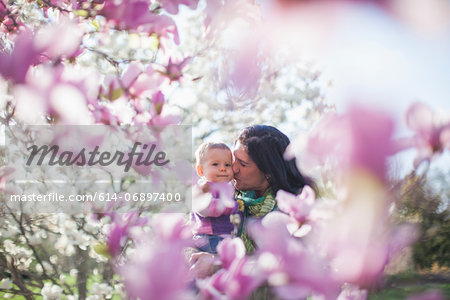 Granddaughter and grandmother amongst magnolia blossom Granddaughter and grandmother amongst magnolia blossom