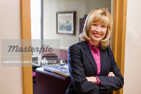 Portrait of mature female outside home office