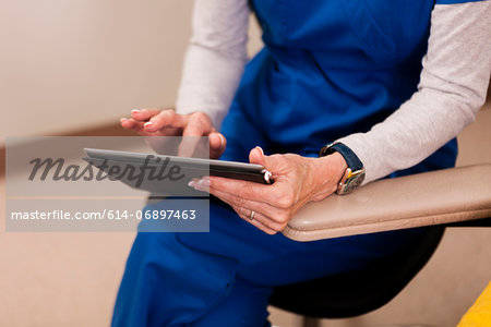 Doctor using digital table, close up