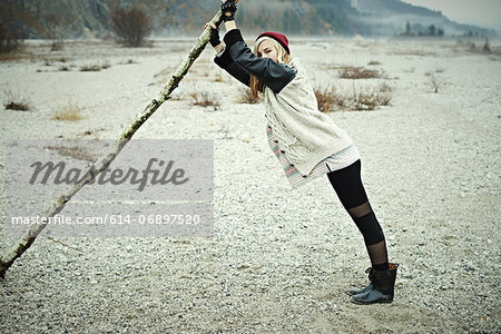 Woman holding log