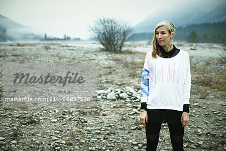 Woman standing in remote setting Woman standing in remote setting