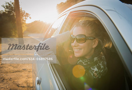 Woman looking out of car window