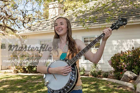 Teenage girl playing banjo