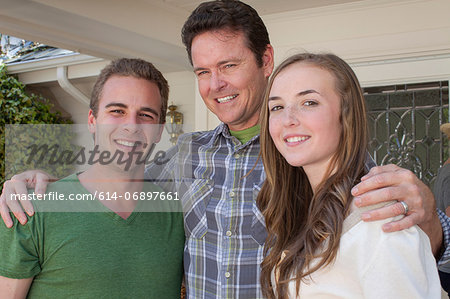 Portrait of father with adult offspring
