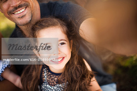 Father and daughter photographing themselves