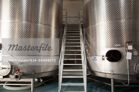 Metal vats in vineyard