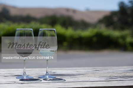 Glasses of red and white wine, close-up