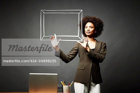 Woman holding up a picture frame