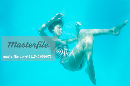 Woman swimming underwater