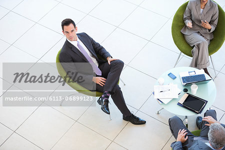 High angle portrait of businessman in meeting