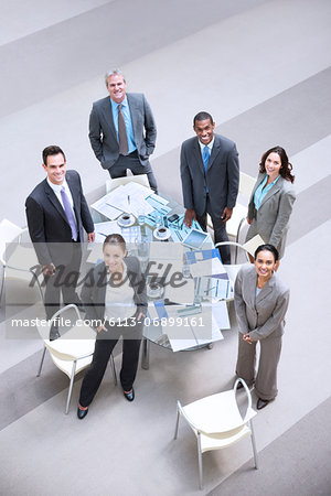 High angle portrait of smiling business people at table