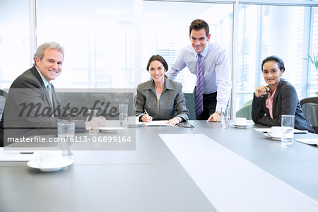 Portrait of smiling business people meeting in conference room