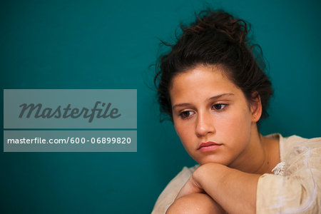 Portrait of teenaged girl, looking downward