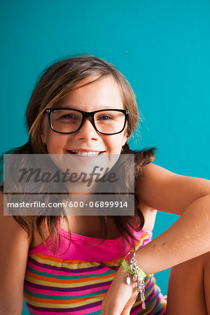 Portrait of girl wearing eyeglasses, smiling at camera, Germany