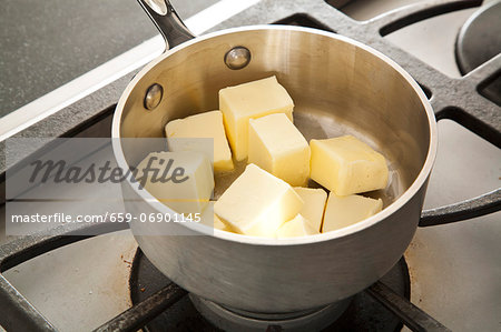 Cubes of Butter in a Pot on the Stove for Melting