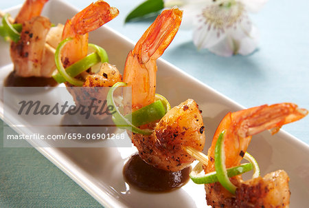 Fried prawn kebabs with limes and a tamarind sauce