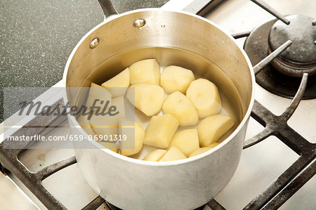 Peeled and Chopped Potatoes in a Pot of Water for Boiling