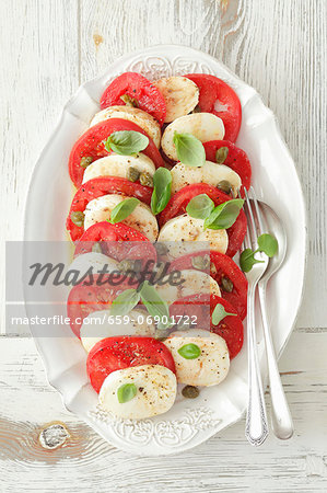 Tomatoes with mozzarella and basil