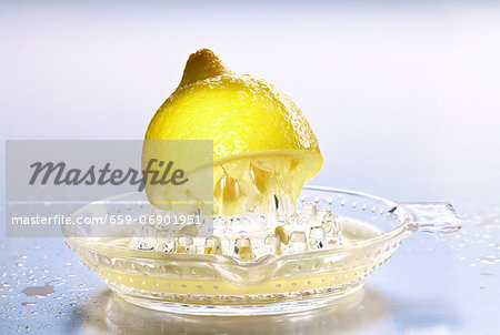 Half a lemon on lemon squeezer