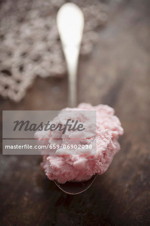 Strawberry ice cream on a spoon Strawberry ice cream on a spoon
