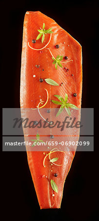 Smoked side of salmon with herbs and spices