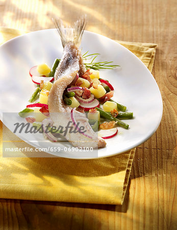 Young herring with potato salad, radishes and green beans