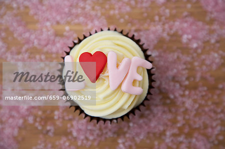 Chocolate cupcake with 'love' written on it