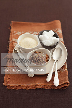 Assorted types of sugar in small bowls