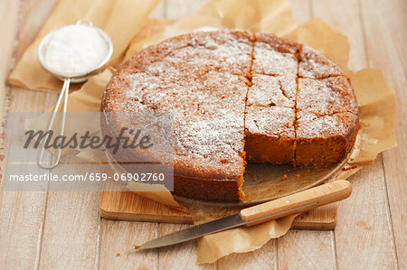 Carrot cake topped with icing sugar