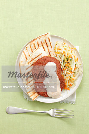 Grilled tortillas with Frikadellen (German meat patties), coleslaw and yoghurt sauce Grilled tortillas with Frikadellen (German meat patties), coleslaw and yoghurt sauce
