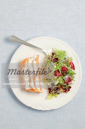 Smoked salmon and cream cheese terrine served with salad Smoked salmon and cream cheese terrine served with salad