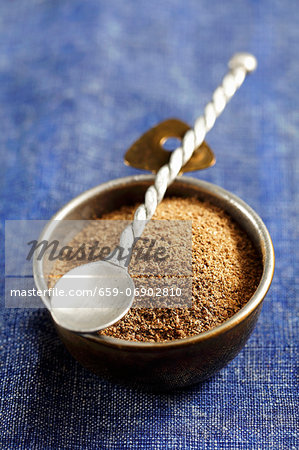 A small bowl of ground coriander